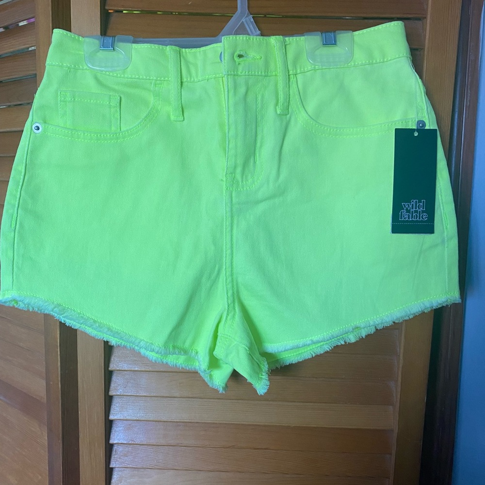 Neon green denim shorts. Size 4 with tag.